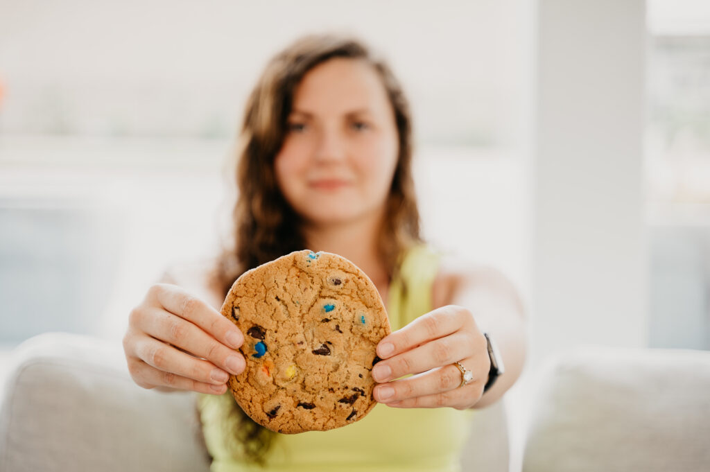 woman holding a cookie