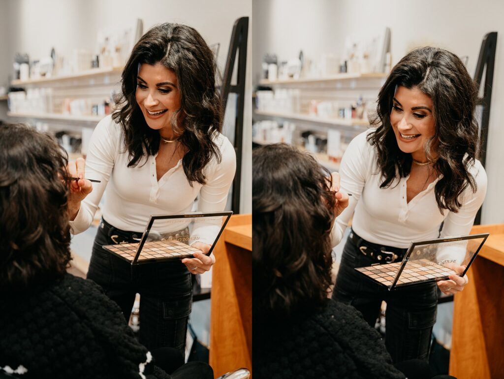 Esthetician Amanda applying makeup on a client in a bright, modern studio