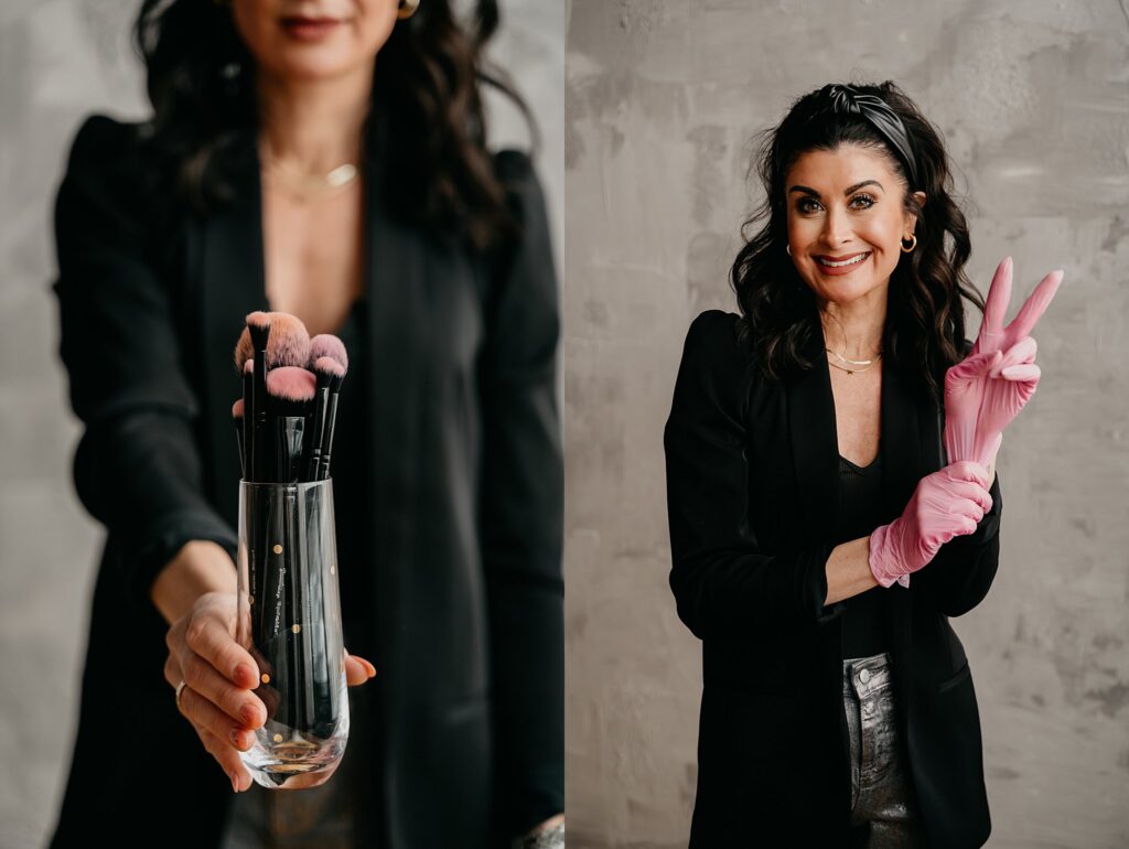 Confident brand portrait of esthetician Amanda in black blazer holding makeup brushes
