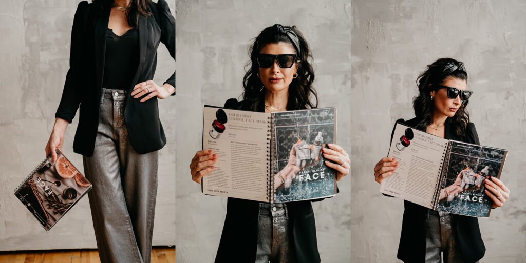 Amanda holding Oliveda skincare magazine in front of studio wall