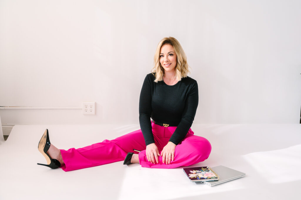 Brand photos with pink pants and heels in Iowa studio