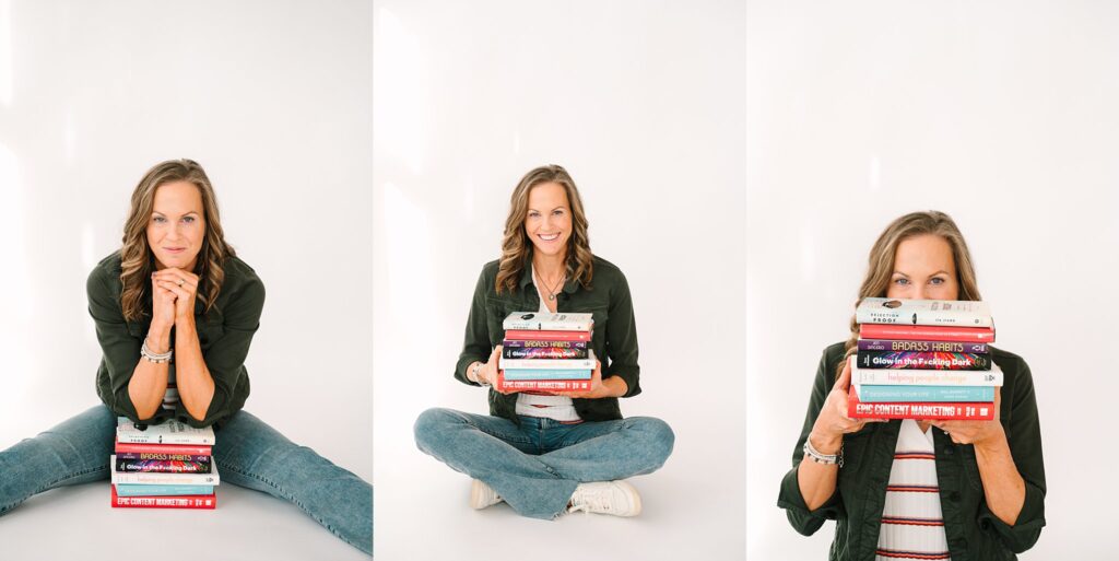 Lydia with stack of business books for coaching brand photos