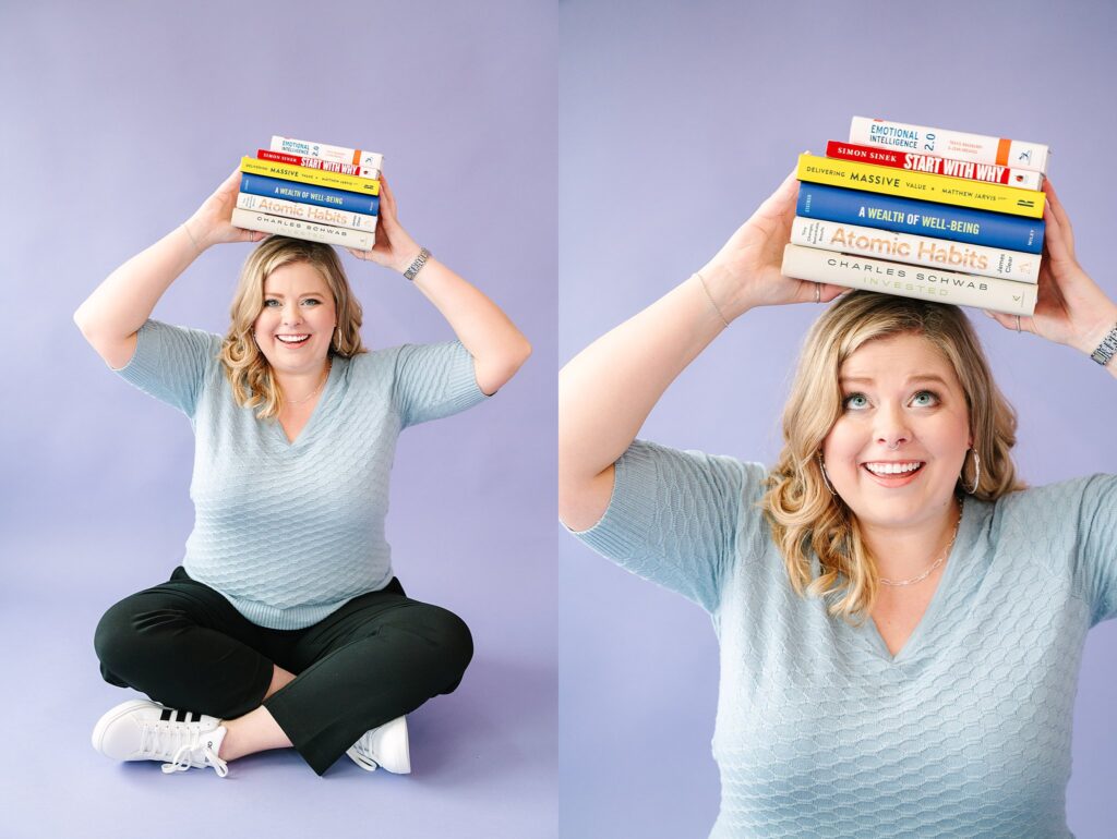 Stack of books on head while sitting in studio